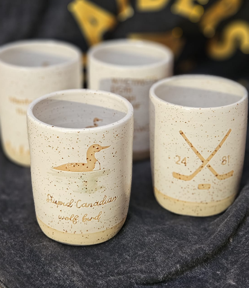 The complete Heated Rivalry mug collection 💙❤️🤍💛🖤