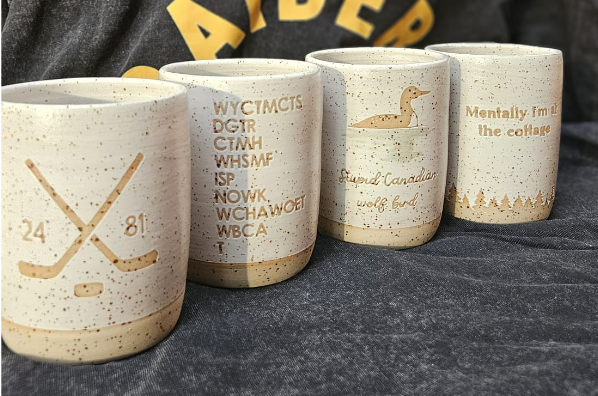 The complete Heated Rivalry mug collection 💙❤️🤍💛🖤